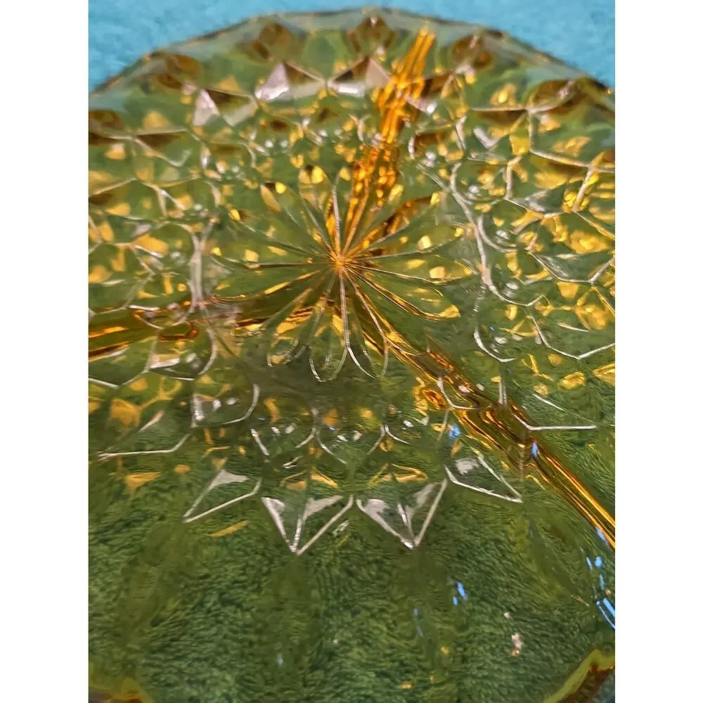 Vintage amber glass divided relish dish with pressed floral pattern.
